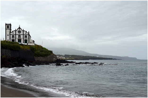 Between Pópulo and Ponta Delgada is the suburb of  São Roque. Here the parish church of São Roque towers above the little bay.